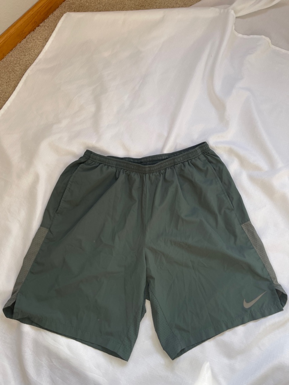 Nike Men’s Olive Green Athletic Shorts. Stretch to 19”